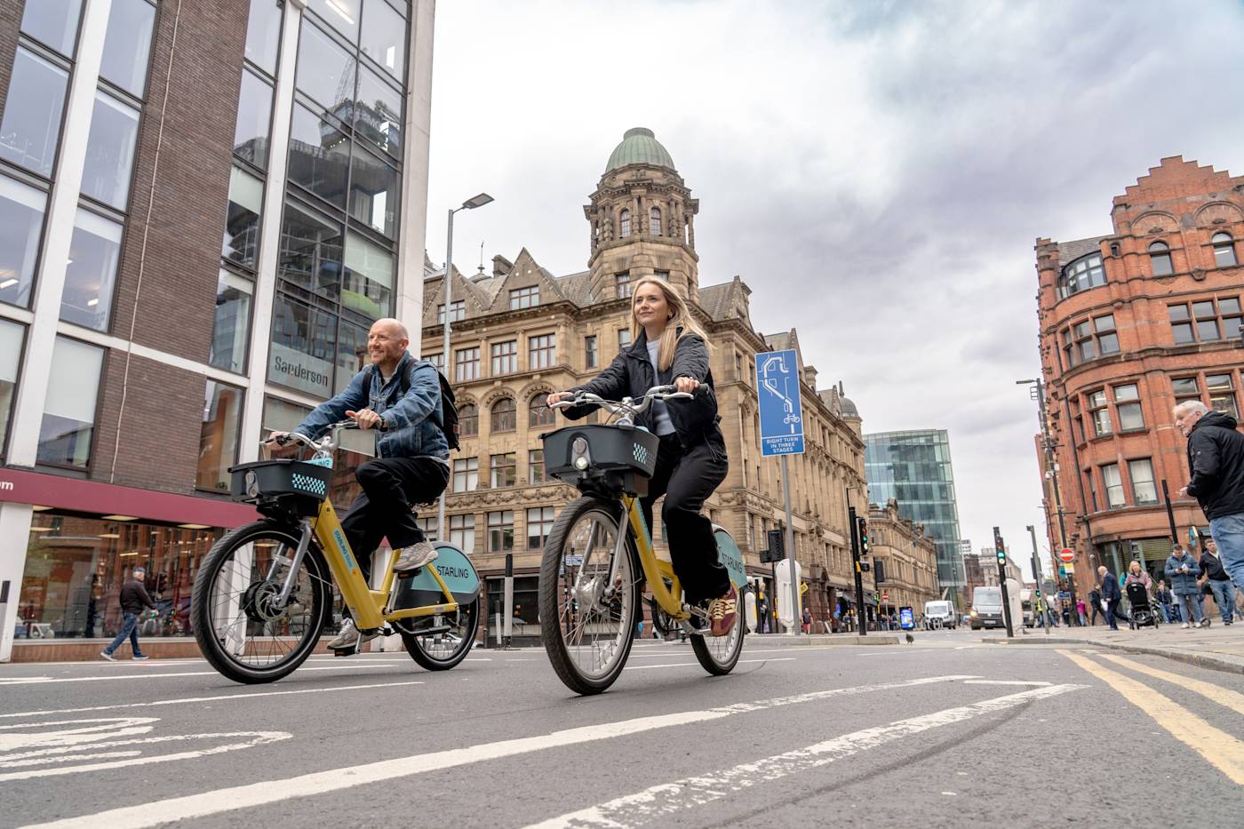 Two people riding starling bikes