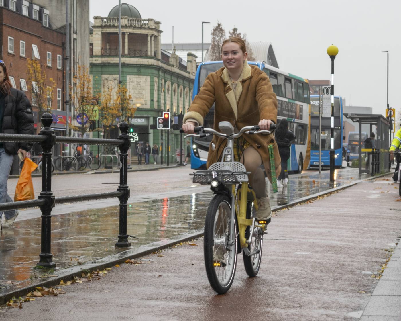 A student riding a cycle hire bike on Oxford Road in Manchester