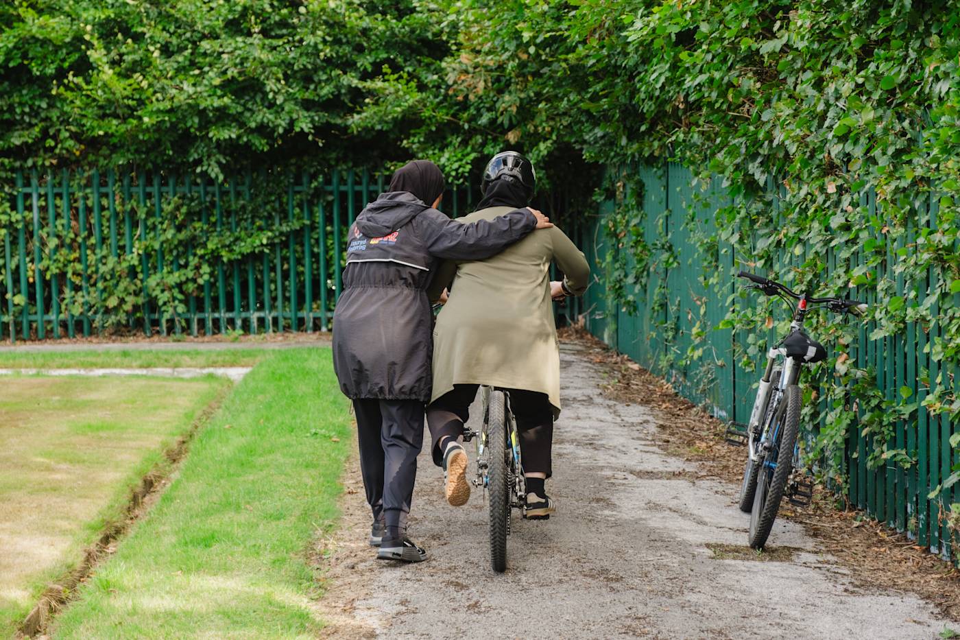 A woman learning how to ride at bike in Bolton