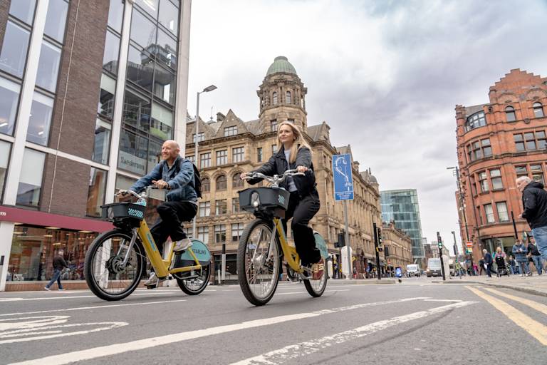 Two people riding starling bikes