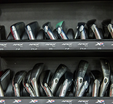 Golf clubs stacked for fittings at the SentryWorld Pro Shop