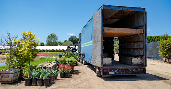 Semi-truck delivering plants 