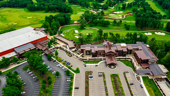 Aerial view of The Inn at SentryWorld, the main property, golf course, and the parking lot