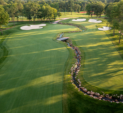 image-card-january-27-announcement-1-396x364 Aerial view of SentryWorld golf course with rock lined stream.