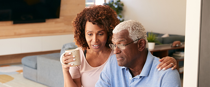 A retired couple talking at home