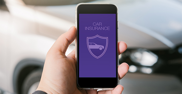 Person looking up car insurance on their mobile phone