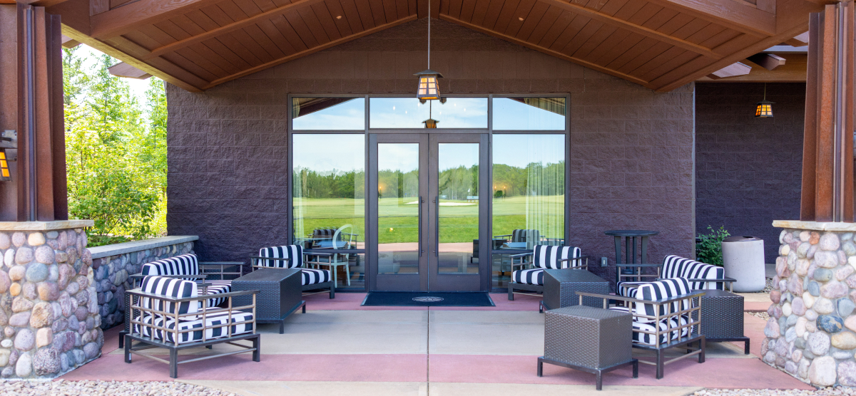 Outdoor patio area with multiple seating areas. 