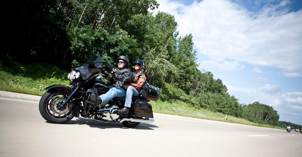 Motorcycle rider and passenger
