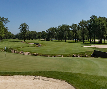 Stream and sand trap along a SentryWorld fairway