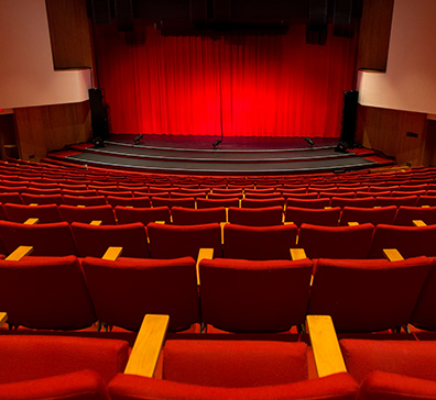 Sentry theater red seats and stage with red curtain