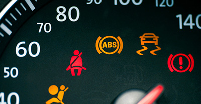 Close-up view of dashboard warning lights