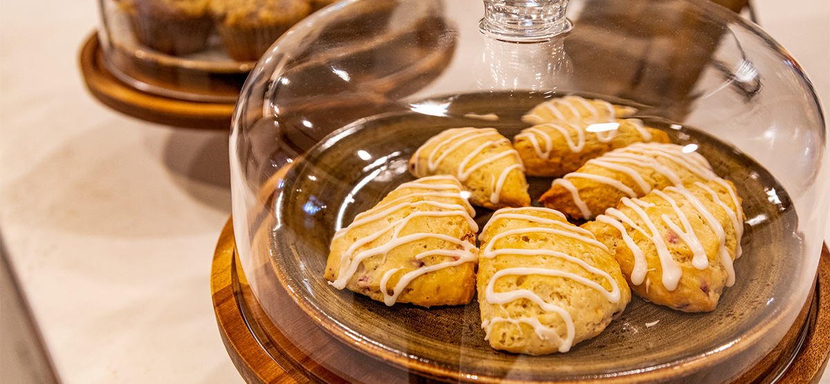 Scones in a glass case at the Library Cafe