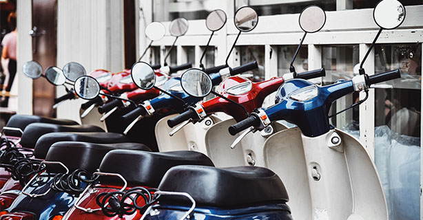 A row of scooters in different colors