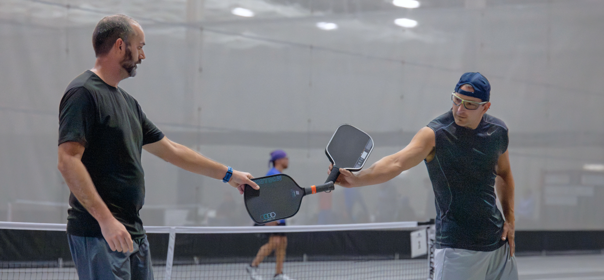 carousel-fall-league-signup-pickleball-3-1200x556 Players play pickleball at the SentryWorld fieldhouse.