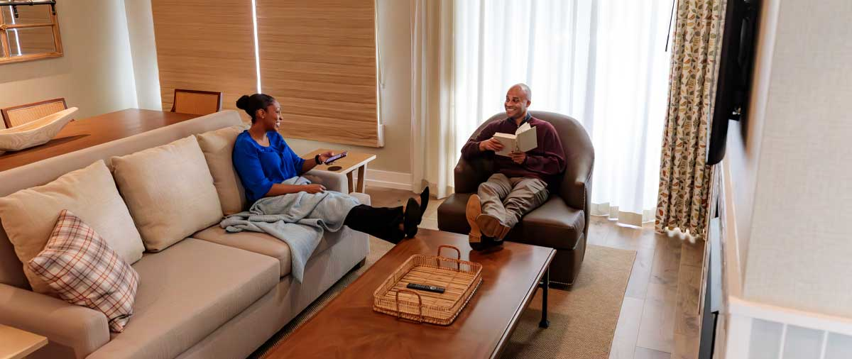 Guests enjoying the lounge area in their room at The Inn at SentryWorld