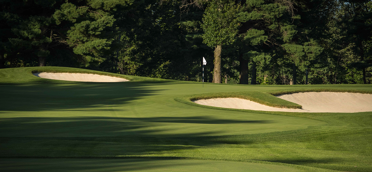 Putting green and sand traps on the seventh hole at SentryWorld