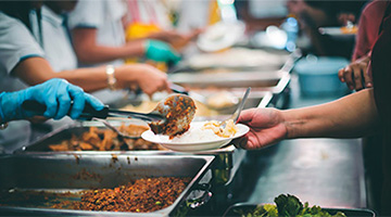 Volunteers serving food