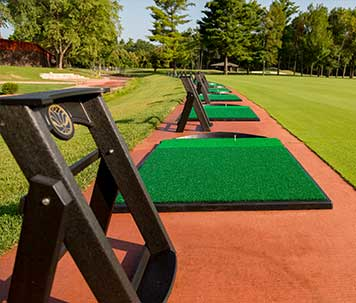 Practice mats at the driving range on the SentryWorld golf course