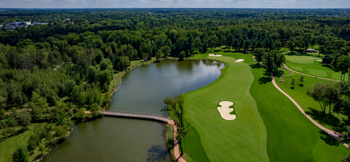 Water hazard with a bridge to the next fairway at the SentryWorld golf course