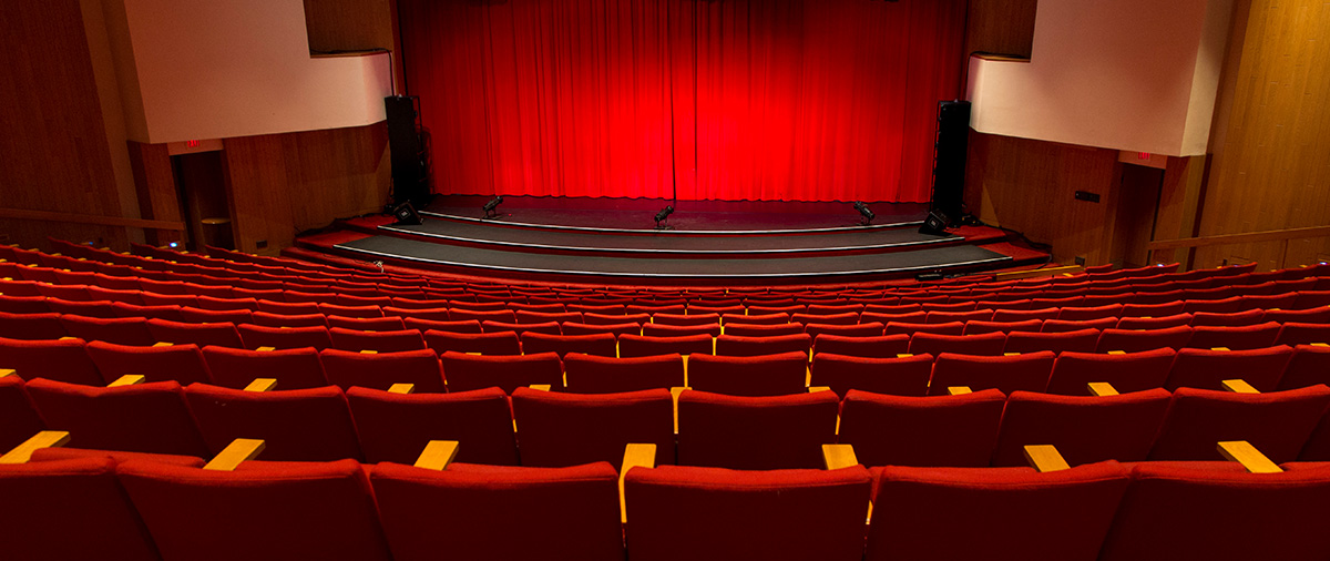 Sentry theater red seats and stage with red curtain