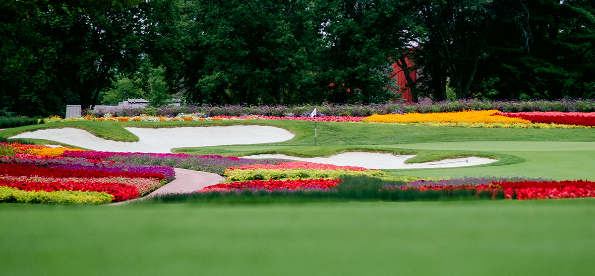 Sand traps and flower hazards on the sixteenth hole at SentryWorld