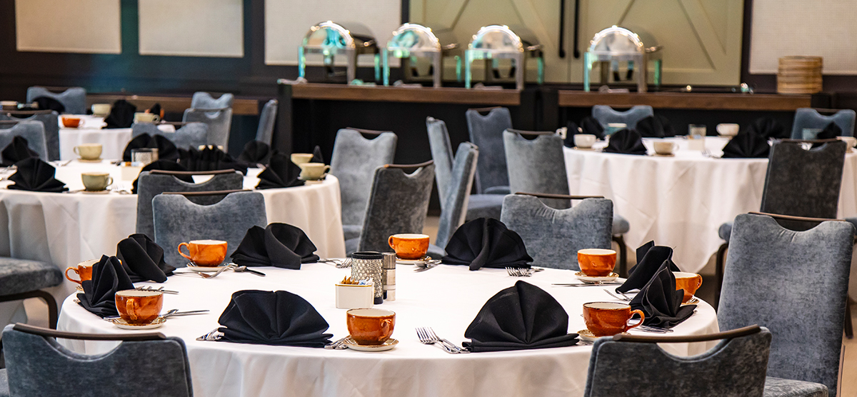 carousel-wedding-venue-inn-gathering-rooms-3-1200x556 Round tables and buffet area in The Inn gathering room.