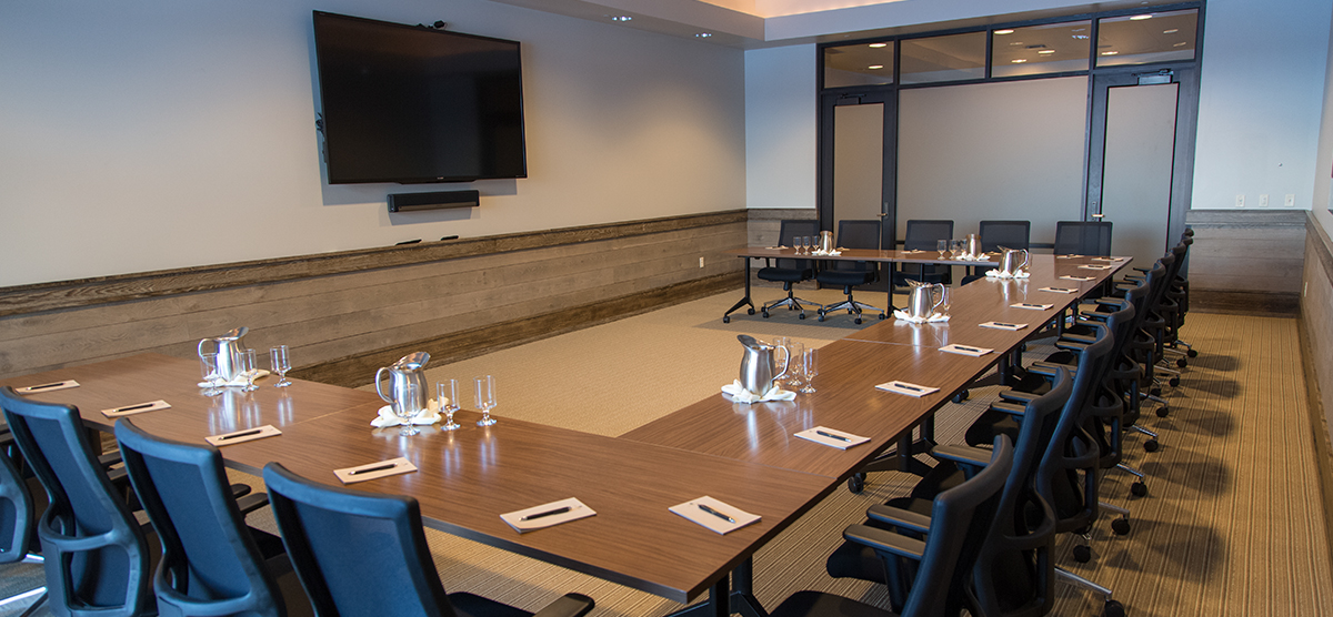 Table set for a meeting the Community Room at SentryWorld