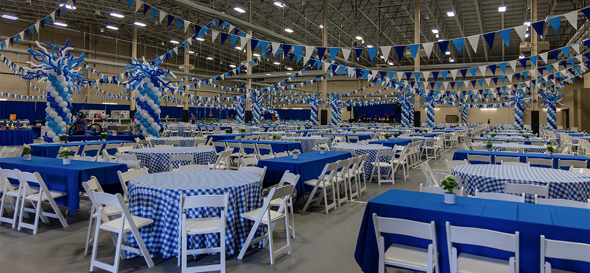 The fieldhouse at SentryWorld decorated with blue and white decor for an event