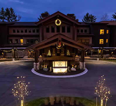 Aerial view of The Inn at SentryWorld with holiday lights in the evening