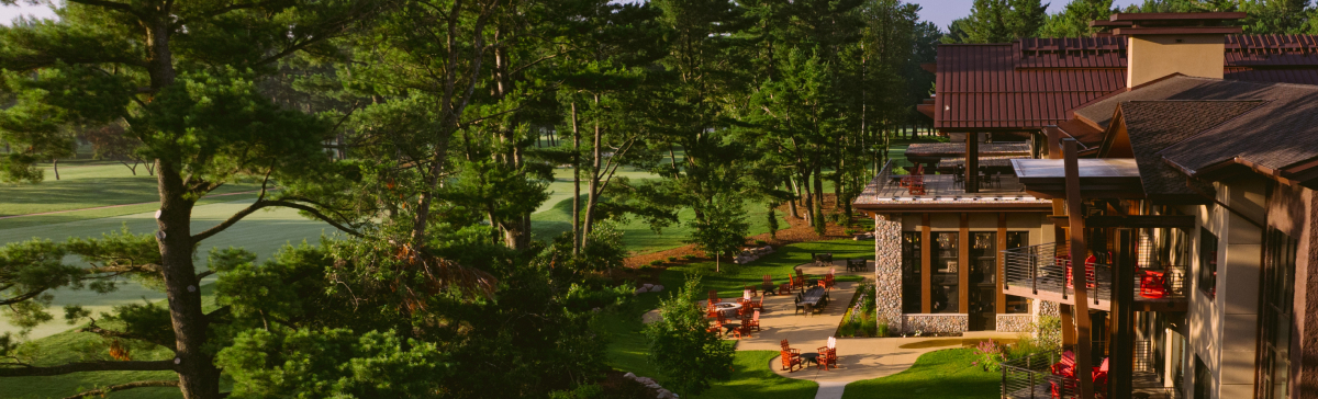 Back exterior view of The Inn at SentryWorld and hole 18. 