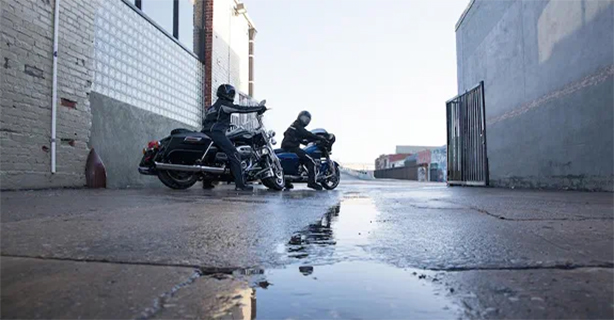 Two motorcycles on a rainy day