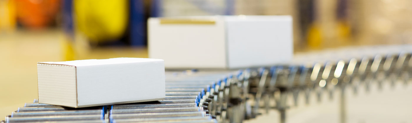 Boxes on distribution line in warehouse