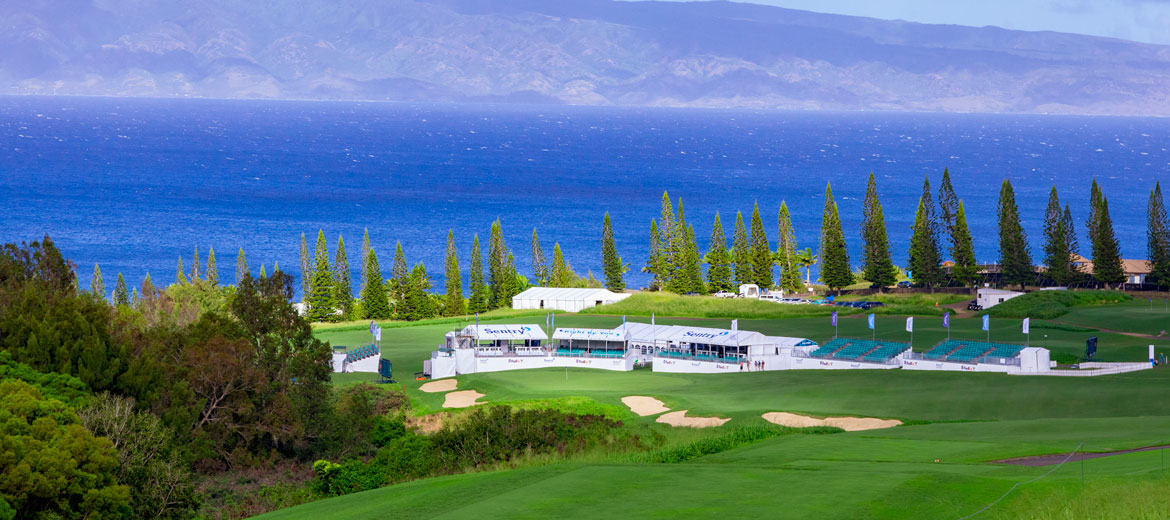 Wide angle shot of hole 18 and the ocean at The Sentry golf tournament