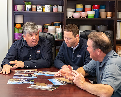 Timbuk Farms employees talking with a Hortica insurance representative