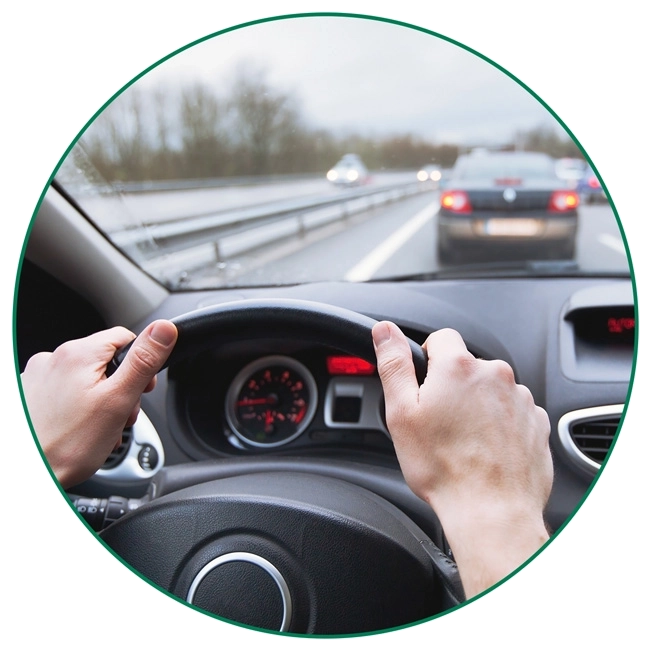 car-driving-near-collision-circle-crop-XS Hands on a steering wheel