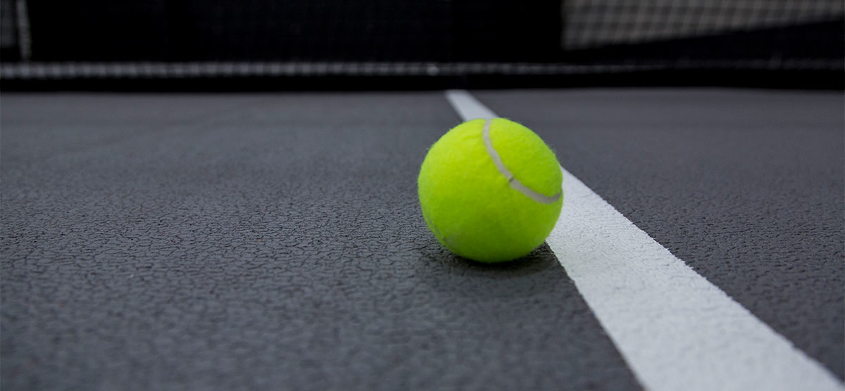 Tennis ball on a court in the SentryWorld fieldhouse