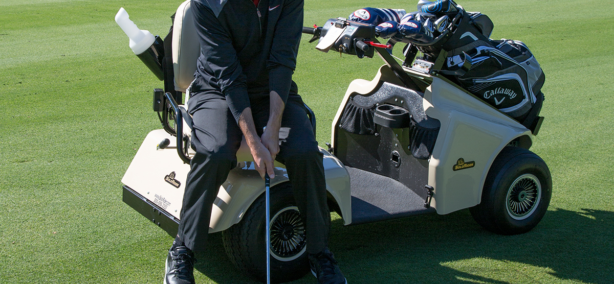 Player hitting from a handicap accessible golf cart at SentryWorld