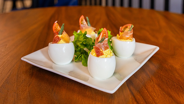 Four lux eggs on a plate.