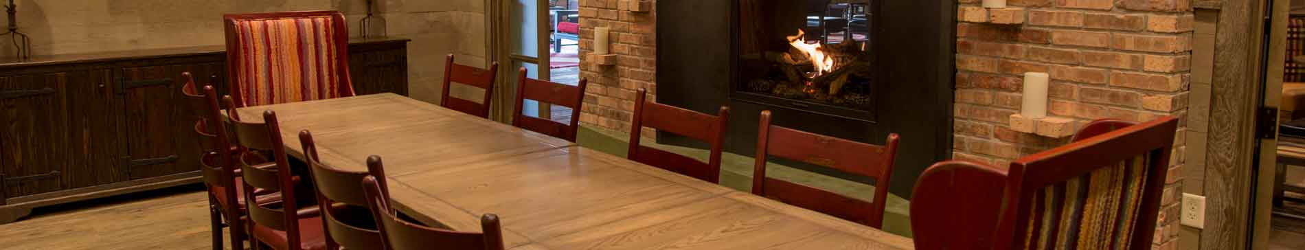 Long table next to the fireplace in the Celebration Room at PJ's at SentryWorld