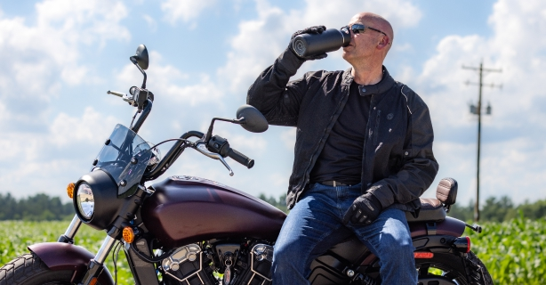 Motorcycle rider drinking water