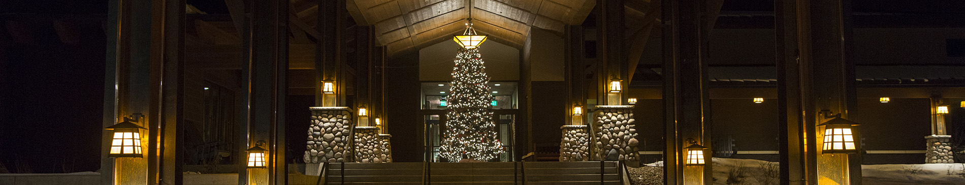 SentryWorld entrance at night with holiday decorations.