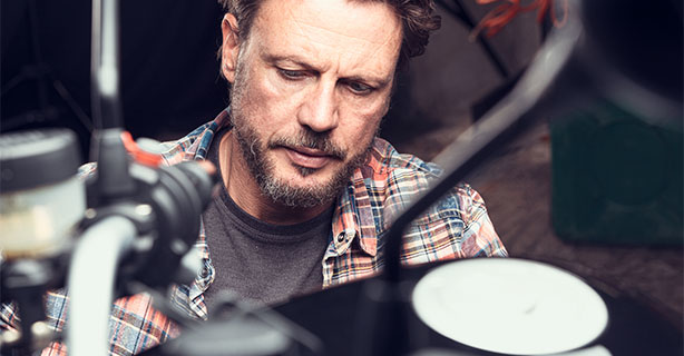 Middle-aged man in a bike workshop