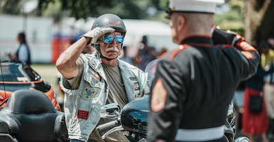 Biker and veteran salute each other