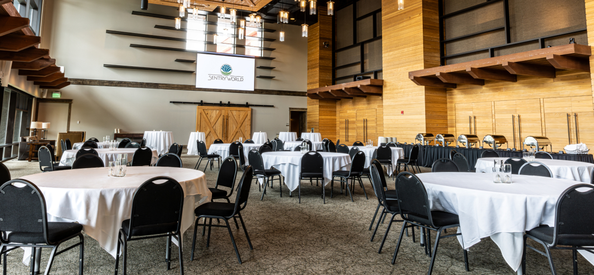 carousel-corporate-event-full-day-2-1200x556 Tables set in the Atrium for a meeting.