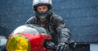 Motorcycle rider bundled up in winter