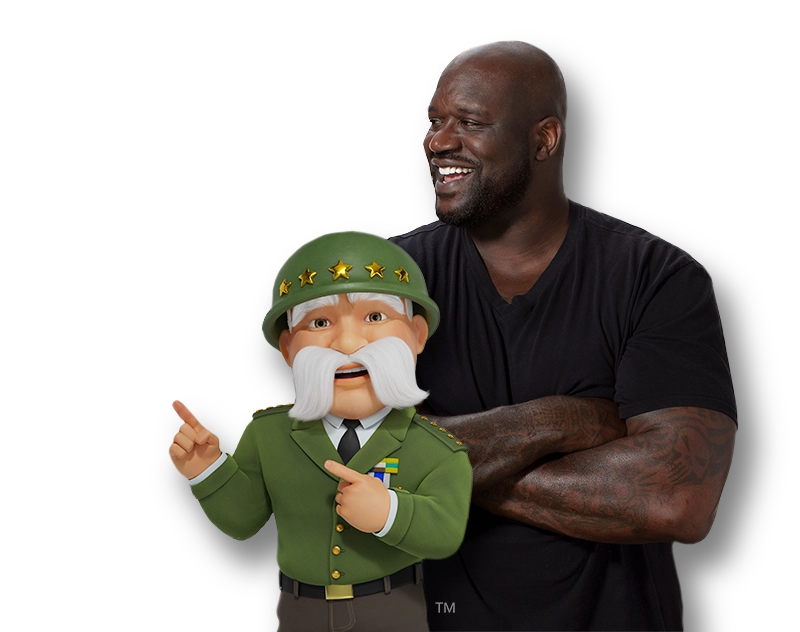 shaq-blk-shirt-TG-pointing-right-shoot Foto de Shaquille O'Neal usando una camiseta negra con los brazos cruzados