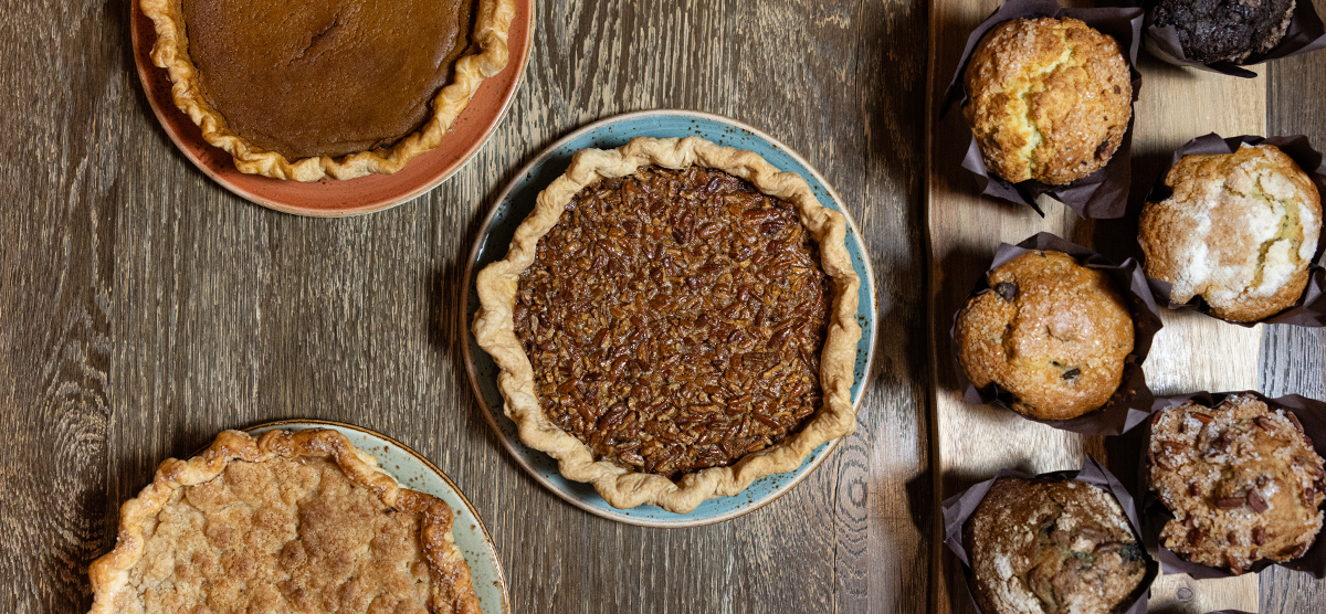 Pie and muffins on a table. 