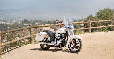Parked Harley-Davidson motorcycle by highway lookout