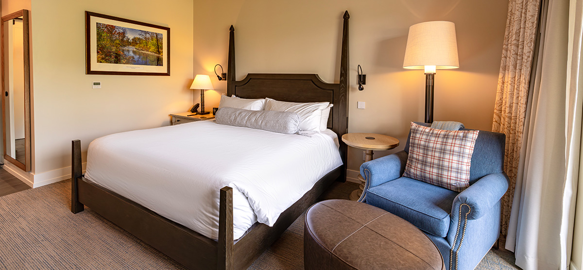 carousel-king-terrace-1-1200x556 King bed with chair and ottoman.