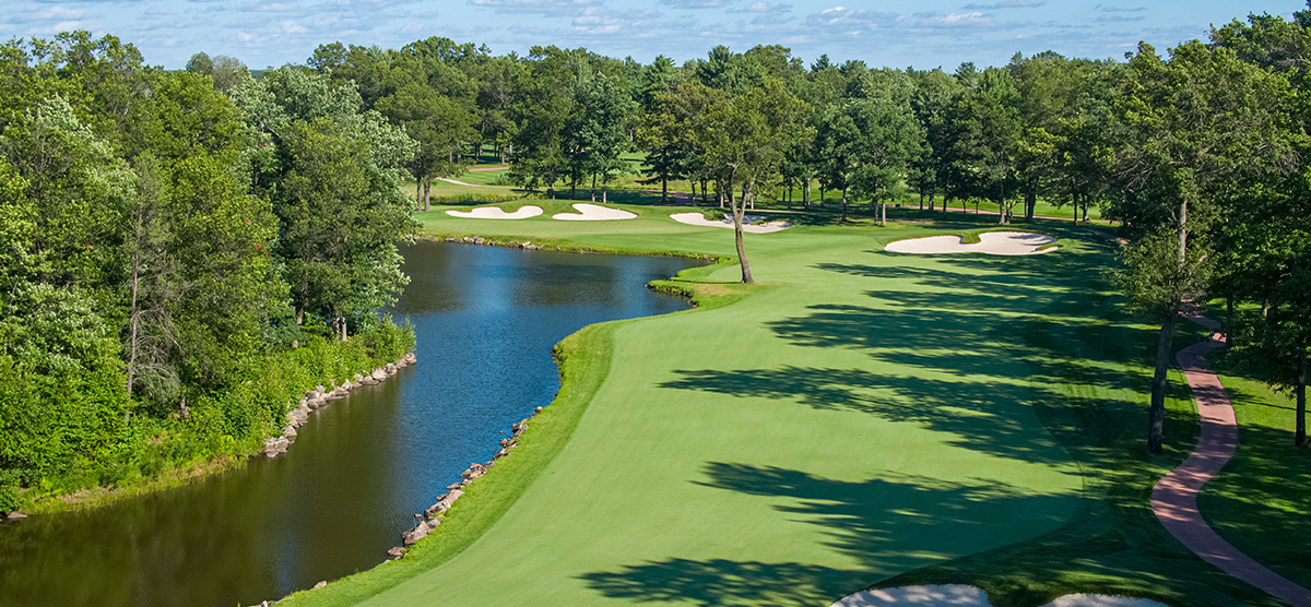 Aerial view of the water hazard and fairway for the fifth hole at SentryWorld